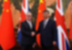 U.K. Prime Minister Keir Starmer shakes hands with Chinese President Xi Jinping ahead of a bilateral meeting during his visit to China, in Beijing. Image: REUTERS