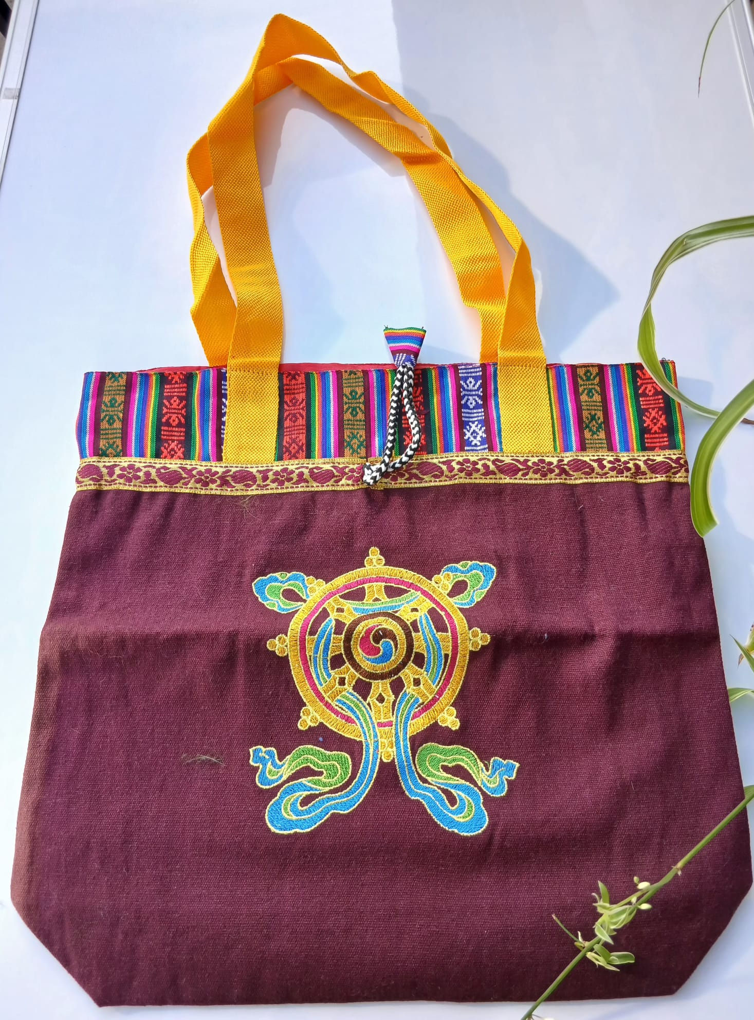 Shoulder bag in brown cloth with Dharma Wheel