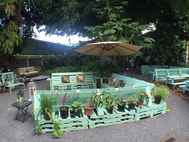 Recycle Pallets serve as benches and bar