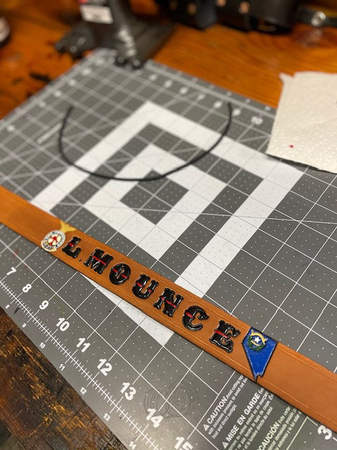 Thumbnail: Custom Tan Leather Helmet Band in the process of being made