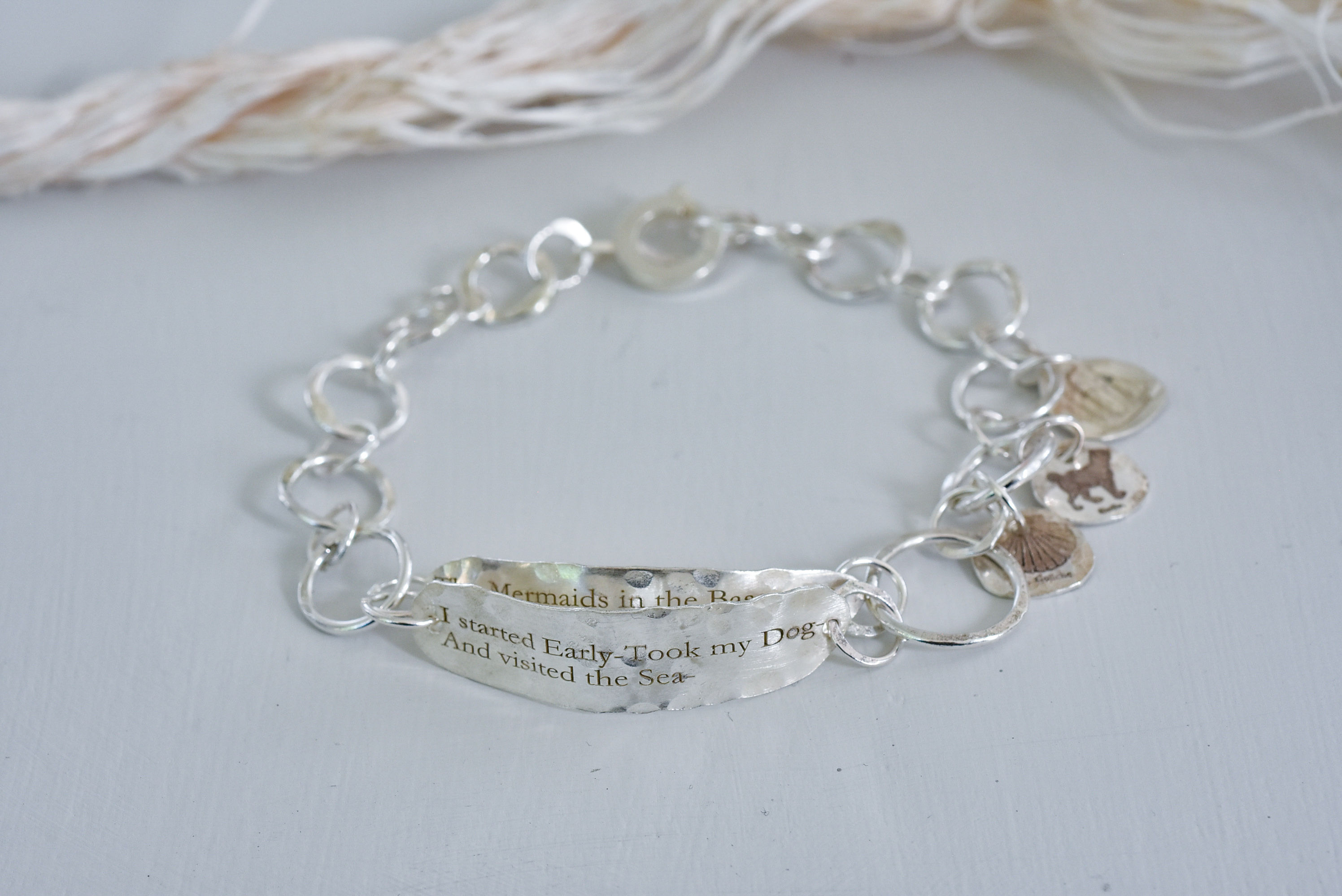 Silver link Bracelet with poem and motifs- I started early