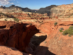 Cassidy Arch natural sandstone arch from above Capitol Reef National Park Utah