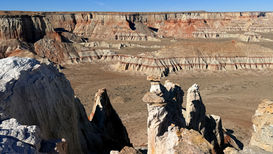 Hoodoos and open canyon floor in Ha Ho No Geh Canyon badlands