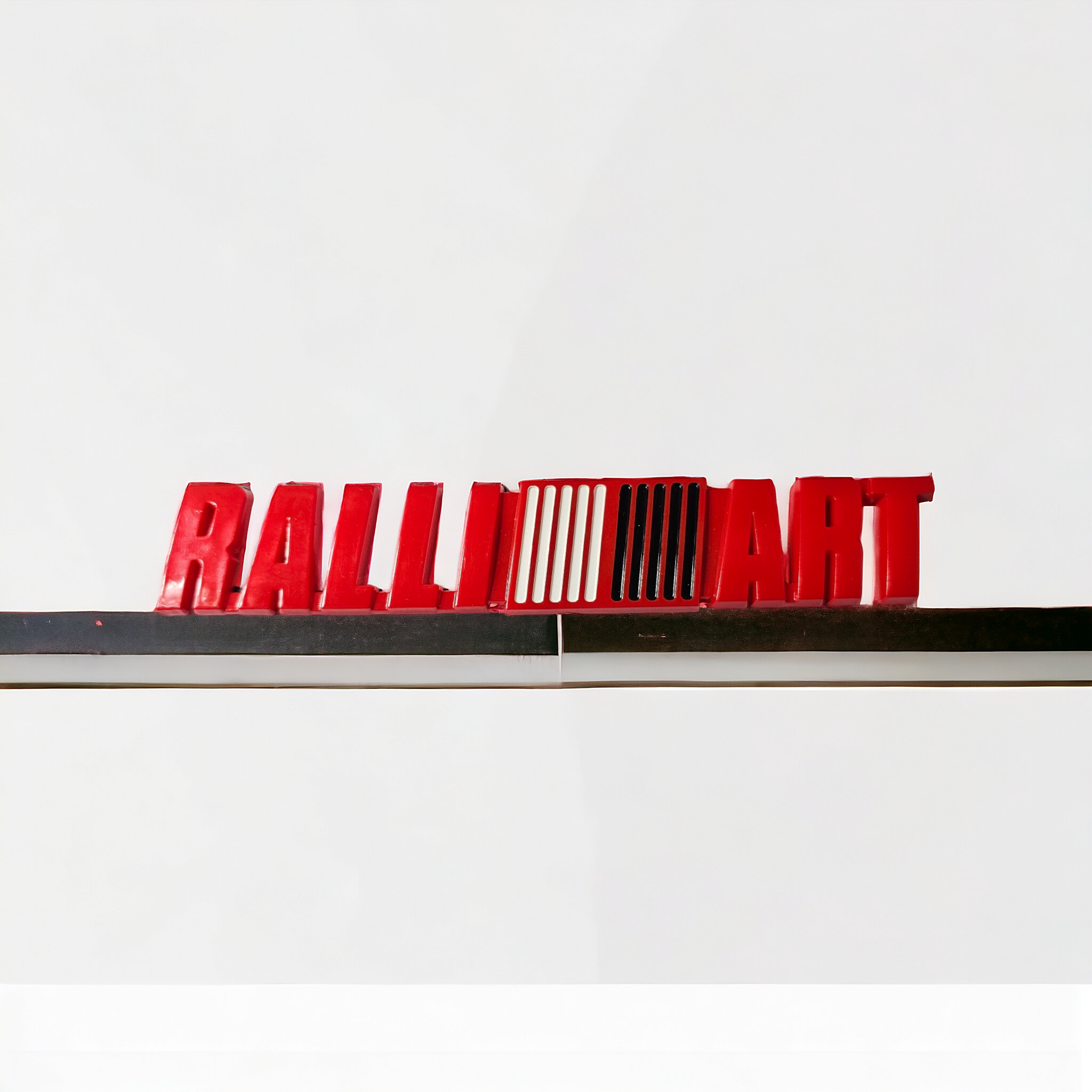 Emblema RALLIART plástico adherible