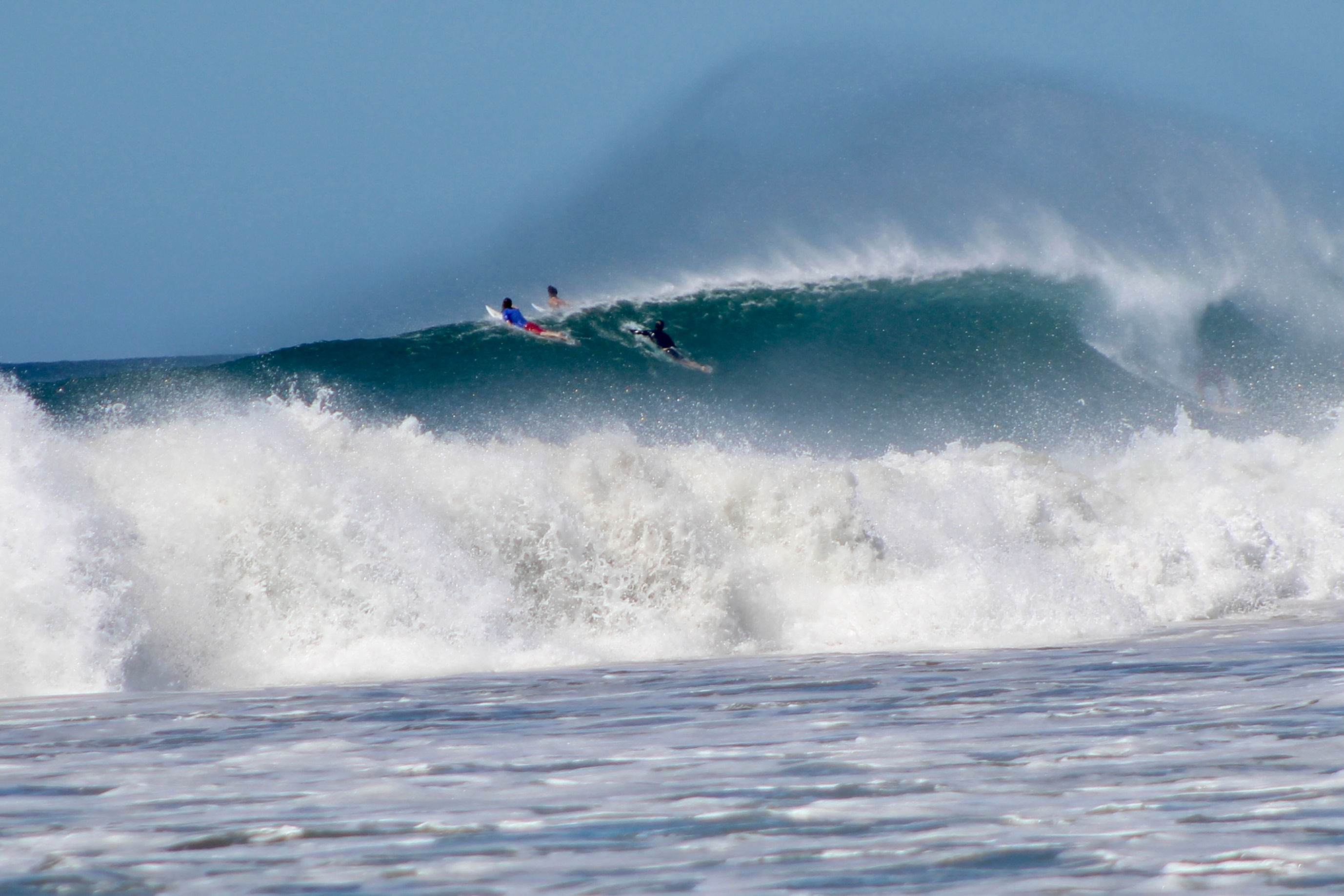 Surfer riding a wave during a Playa Marbella surf trip