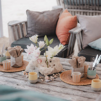 A detailed view of a bohemian-themed table setup for a bespoke corporate event planned by Gobig Travels.