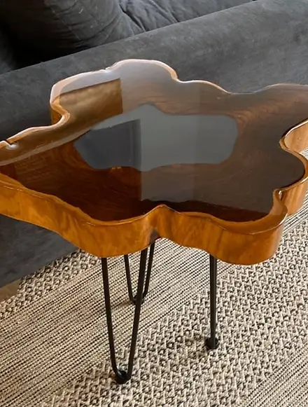 Glossy finished teak crosscut used as a coffee table