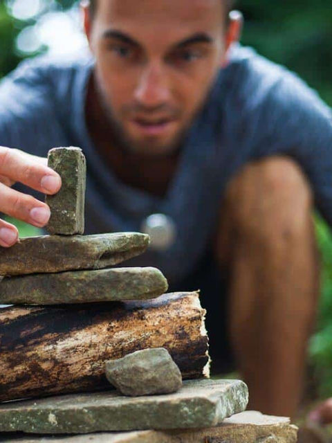  A man balancing rocks. Set intentions everyday for the small stuff to help you achieve the big stuff.