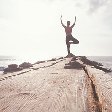 A person practicing yoga, suggesting the potential for better flexibility and stress relief through the therapy.