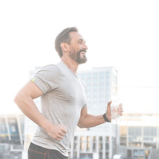 A man running, illustrating the possibilities of enhanced movement and less tension supported by Elena Juni’s gentle therapy.