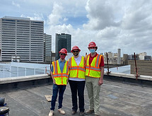 Construction Team on Rooftop in Safety Gear
