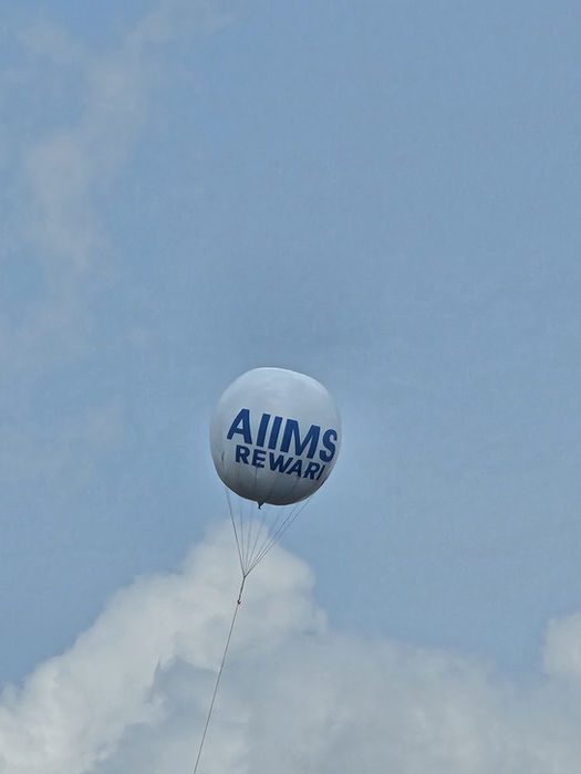 White balloon with AIIMS REWARD text