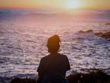 A lonely expat looking at the sea