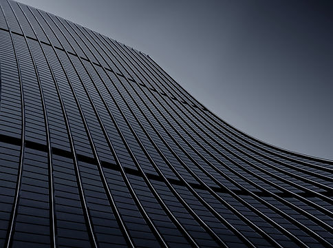 low-angle-shot-of-a-modern-business-building-touching-the-clear-sky.jpg