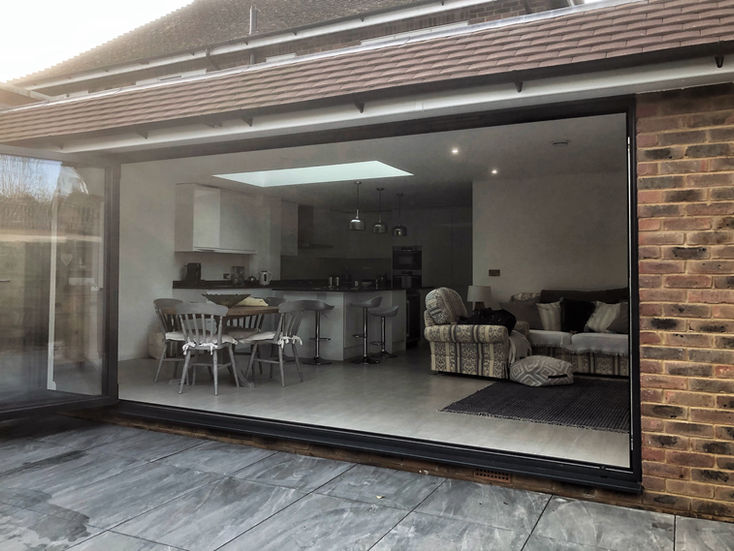 a living room with a table and chairs and a couch