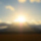 beautiful bright yellow sun coming out of the clouds in southeast alaska.jpg