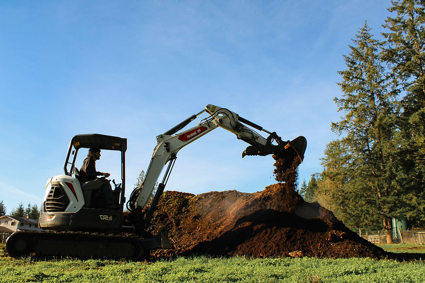 excavator morving dirt.jpg