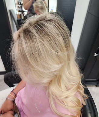 Blonde highlights with a soft shadow root and dimensional color.