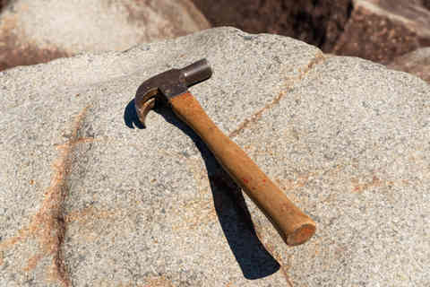 Hammer striking the ringing rocks in Upper Black Eddy, Pennsylvania, USA.