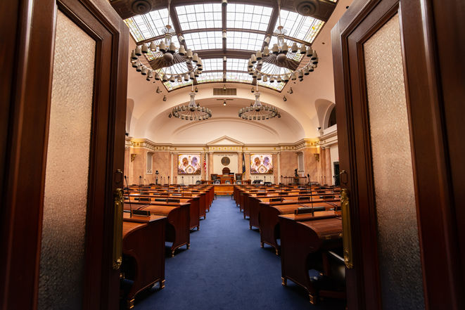 Wooden desks lined up inside the Kentucky house of representatives.  Kentucky state capitol building, Frankfort, Kentucky, USA.