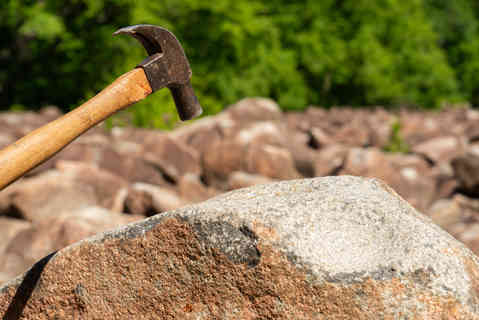 Hammer striking the ringing rocks in Upper Black Eddy, Pennsylvania, USA.