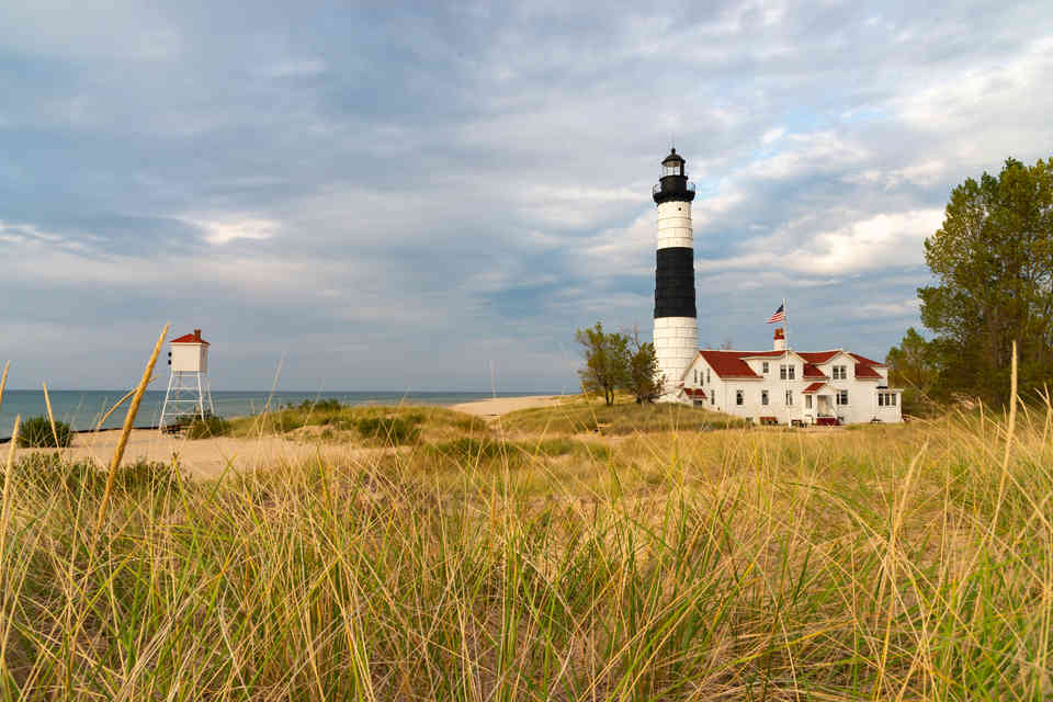 The historic Big Sable Point Lighthouse, built in 1867, with late afternoon lighting in Ludington, Michigan, USA.