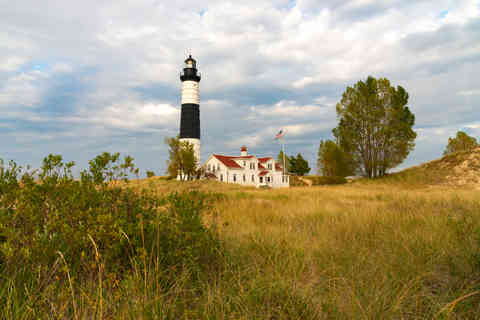 The historic Big Sable Point Lighthouse, built in 1867, with late afternoon lighting in Ludington, Michigan, USA.