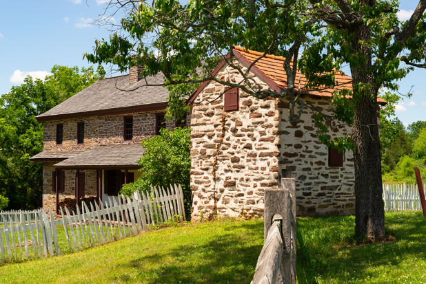 Buildings and landscape at the Daniel Boone Homestead on a beautiful summer afternoon in Birdsboro, Pennsylvania, USA.