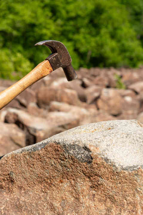 Hammer striking the ringing rocks in Upper Black Eddy, Pennsylvania, USA.