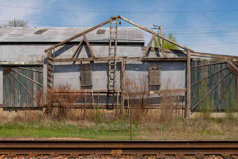 Exterior wall of industrial building along train line in Hampshire, Illinois, USA.