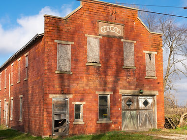 Old brick building in rural town. New Bedford, Illinois, USA.