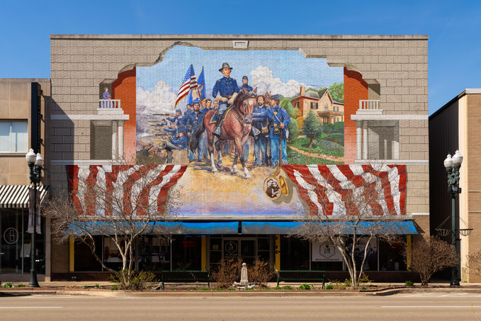 Exterior of downtown building with W.H.L. Wallace mural by artist G. Byron Peck in Ottawa, Illinois, USA.