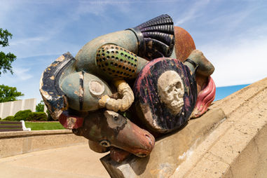 Sculpture entitled "Light Dispelling Darkness" by artist Waylande Gregory in Edison, New Jersey, USA.