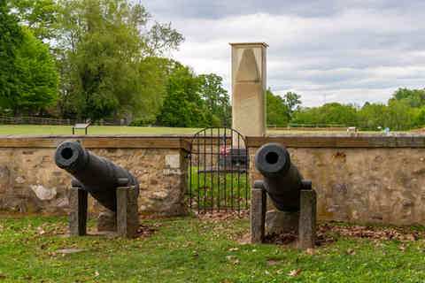 Gravesite and the 1817 Monument at Paoli Battlefield Historical Park on a cloudy Spring afternoon in Malvern, Pennsylvania, USA.
