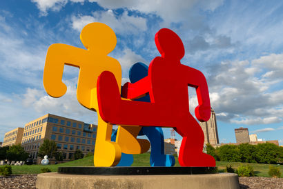 Art installation titled "Untitled (Three Dancing Figures, version C)" by artist Keith Haring, in downtown Des Moines, Iowa, USA.