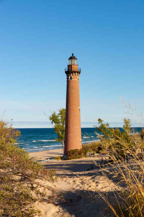 The historic Little Sable Point Lighthouse, built in 1874, on a beautiful Fall morning in Mears, Michigan, USA.
