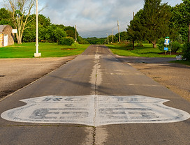 Painted Route 66 sign on historic Route 66 in Ash Grove, Missouri, USA.