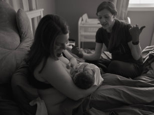 A mom nursing her new baby