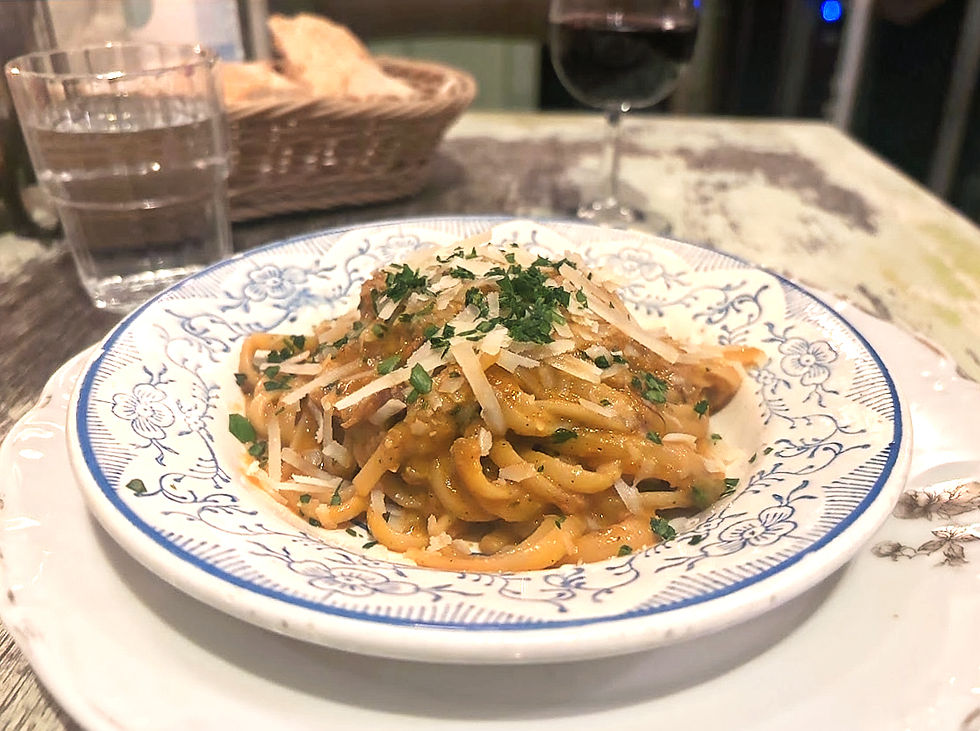 Spaghetti tal-fenek, slow-cooked rabbit sauce that demands bread at the end.