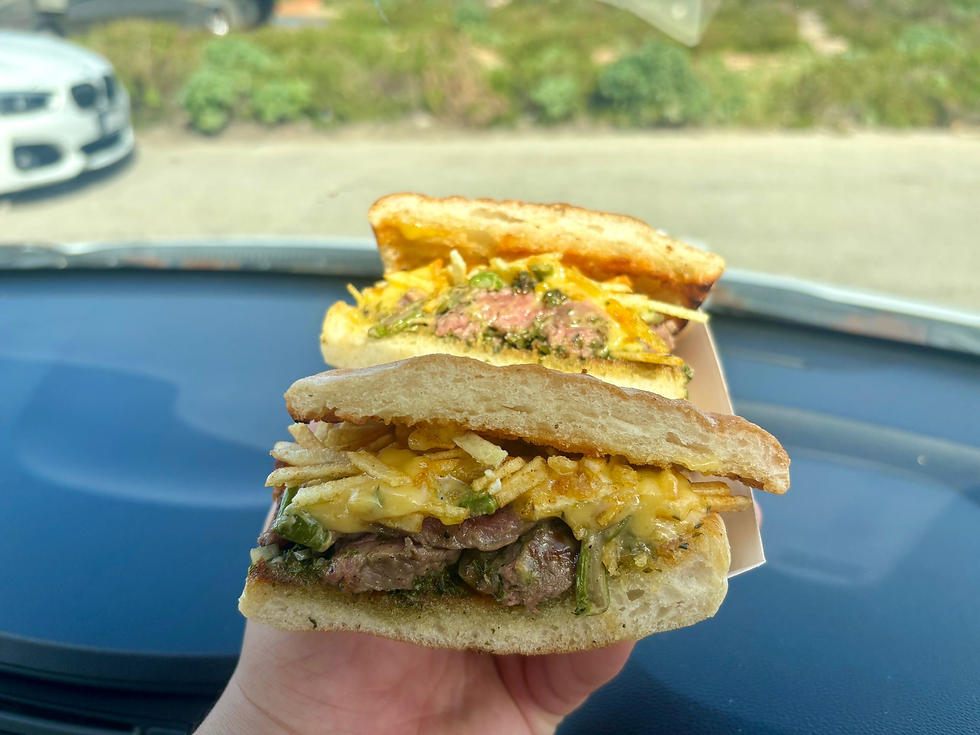 Steak frites dragged through smoke and stuffed into bread like contraband.