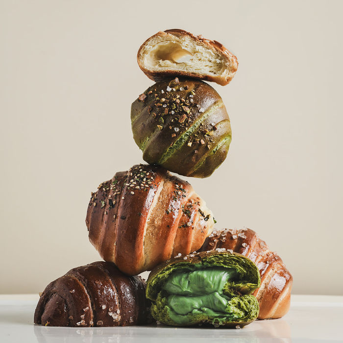 Stack of filled croissants and pastries, bakery photography by Off Menu Studios