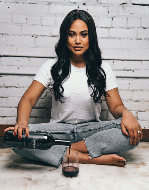 Ayesha Curry with a bottle of wine, brand photography by Off Menu Studios