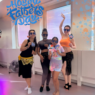Belly dance students posing together for Father's Day at Joy Dance Lab Eindhoven
