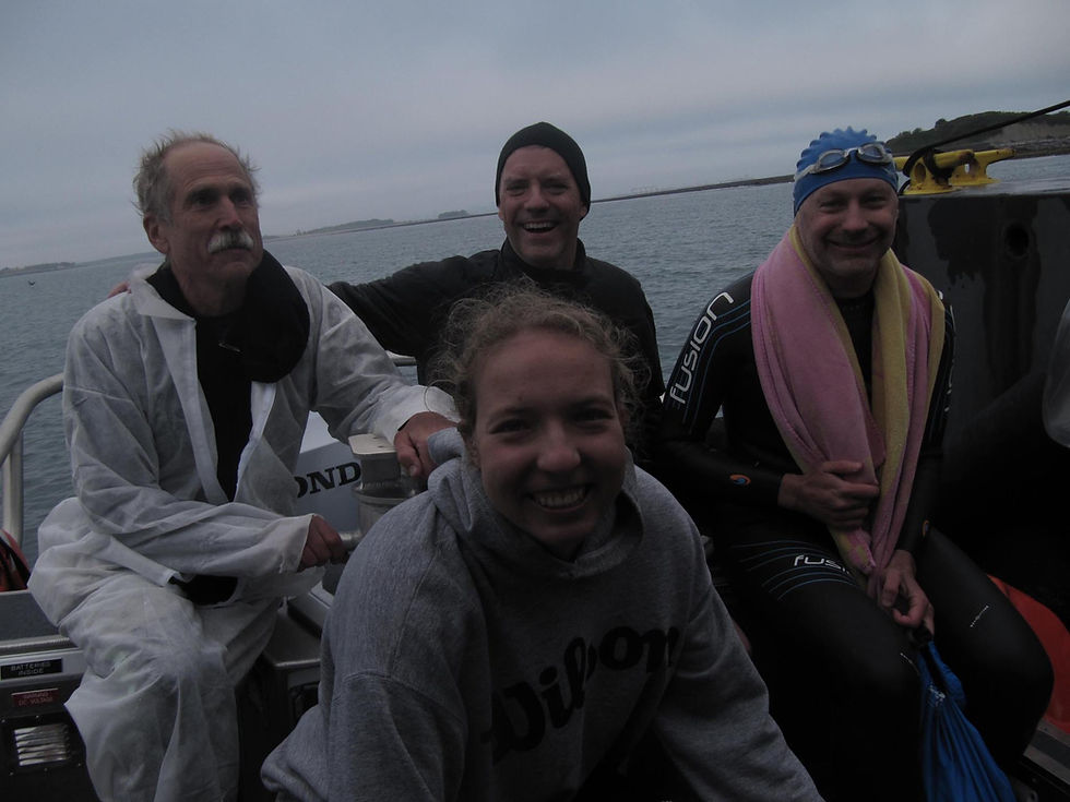 Me, center in the Wilson hoodie, cheesing because I don't have my wetsuit on anymore. I think everyone's mostly happy we're not in deeper trouble so far.