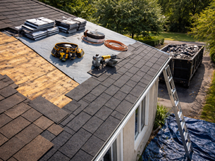 Residential roof re-shingling in progress