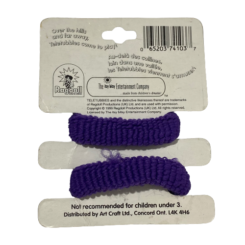 Back view of Teletubbies Tinky Winky purple hair scrunchies packaging, showing product details and manufacturer information.