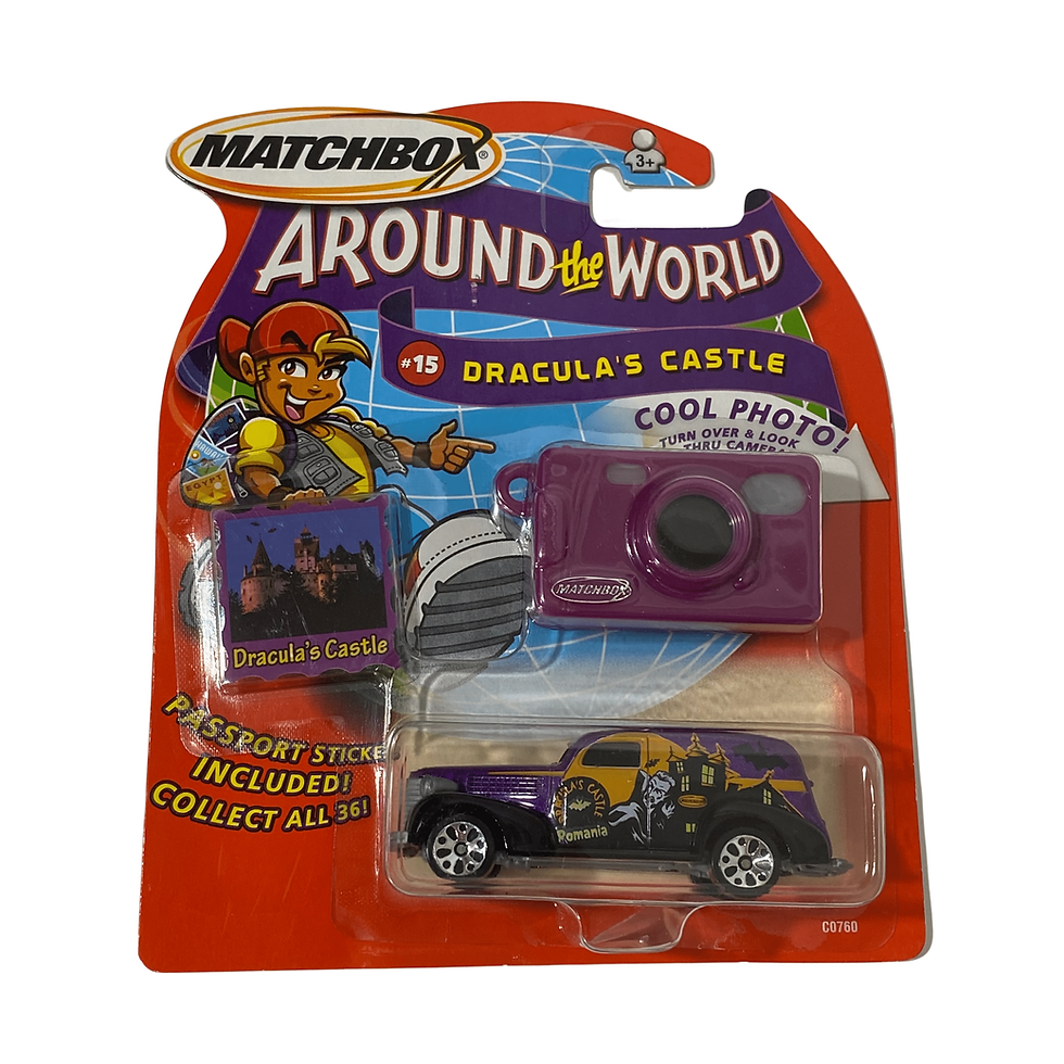 Front view of the 2003 Mattel Matchbox Around The World Dracula's Castle set, featuring a GM Buick car and purple camera.