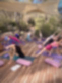 A group practicing yoga at at Glow Retreats Ibiza