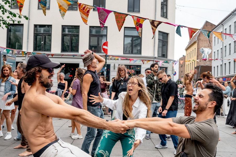 Holding hands and spinning in the street