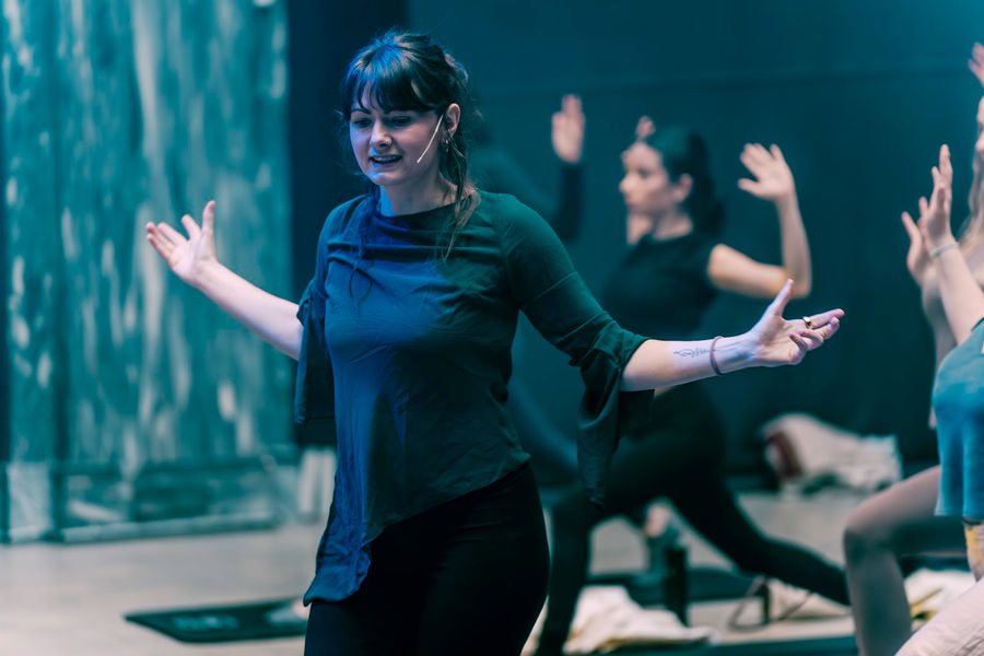 A dancer smiling mid-move